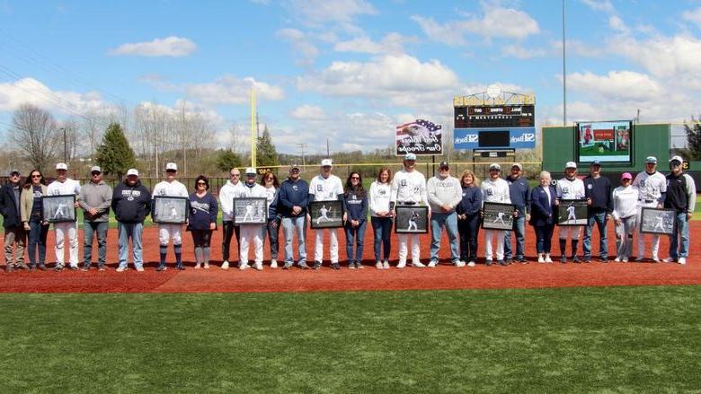 The senior members of the baseball team at 365英国上市杜波依斯分校, 还有他们的家人, during their senior day recognition at Showers Field in 杜波依斯.