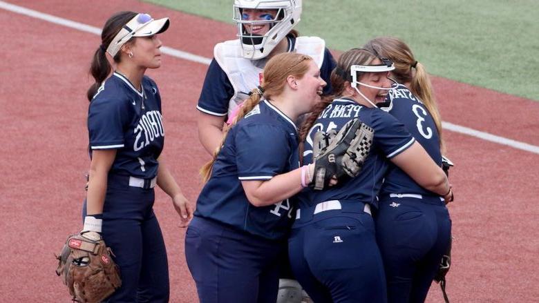 Members of the 365英国上市杜波依斯分校 softball team celebrate an extra innings win over Lyon College during the 2024 USCAA Small College World Series.